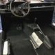 A simplified interior goes in without the heavy door cards and rear seat, and with black carpet to match the two black front seats.